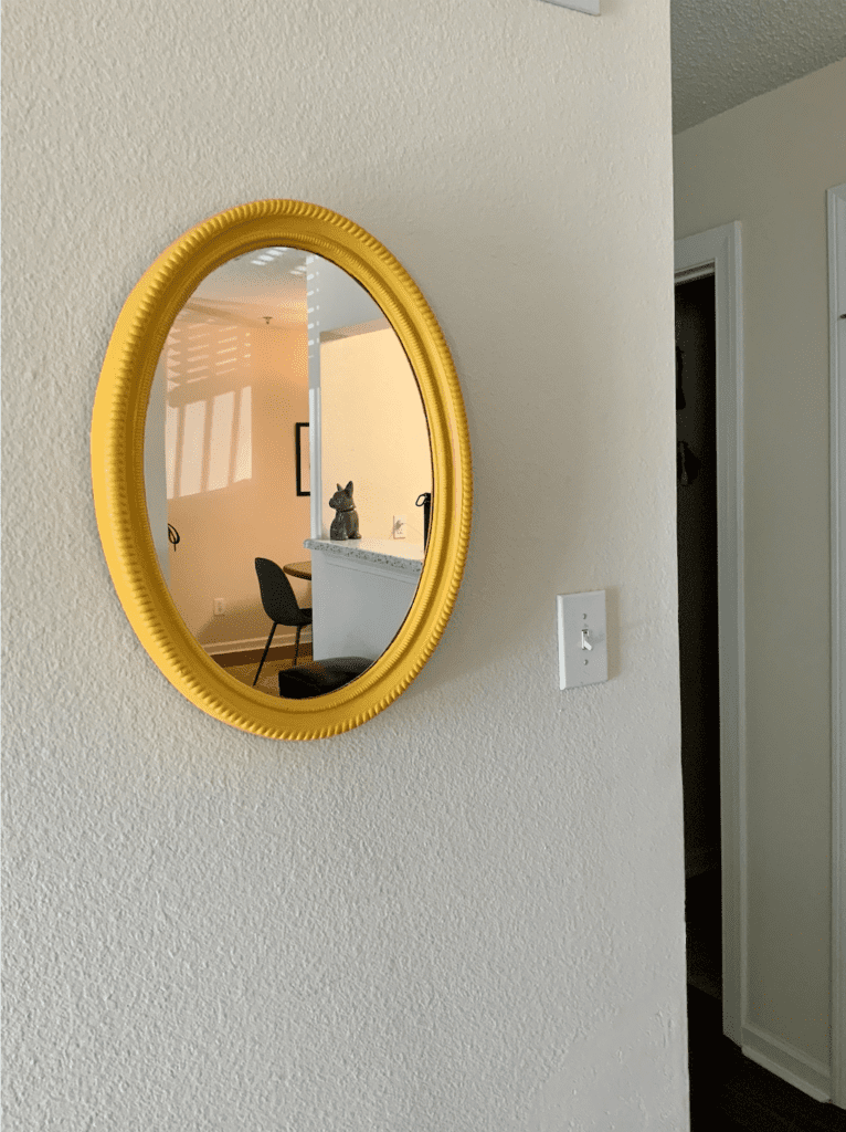 Yellow oval mirror