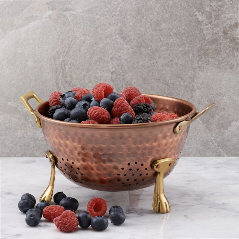 brass collander with berries inside - non-cheesy halloween decorations