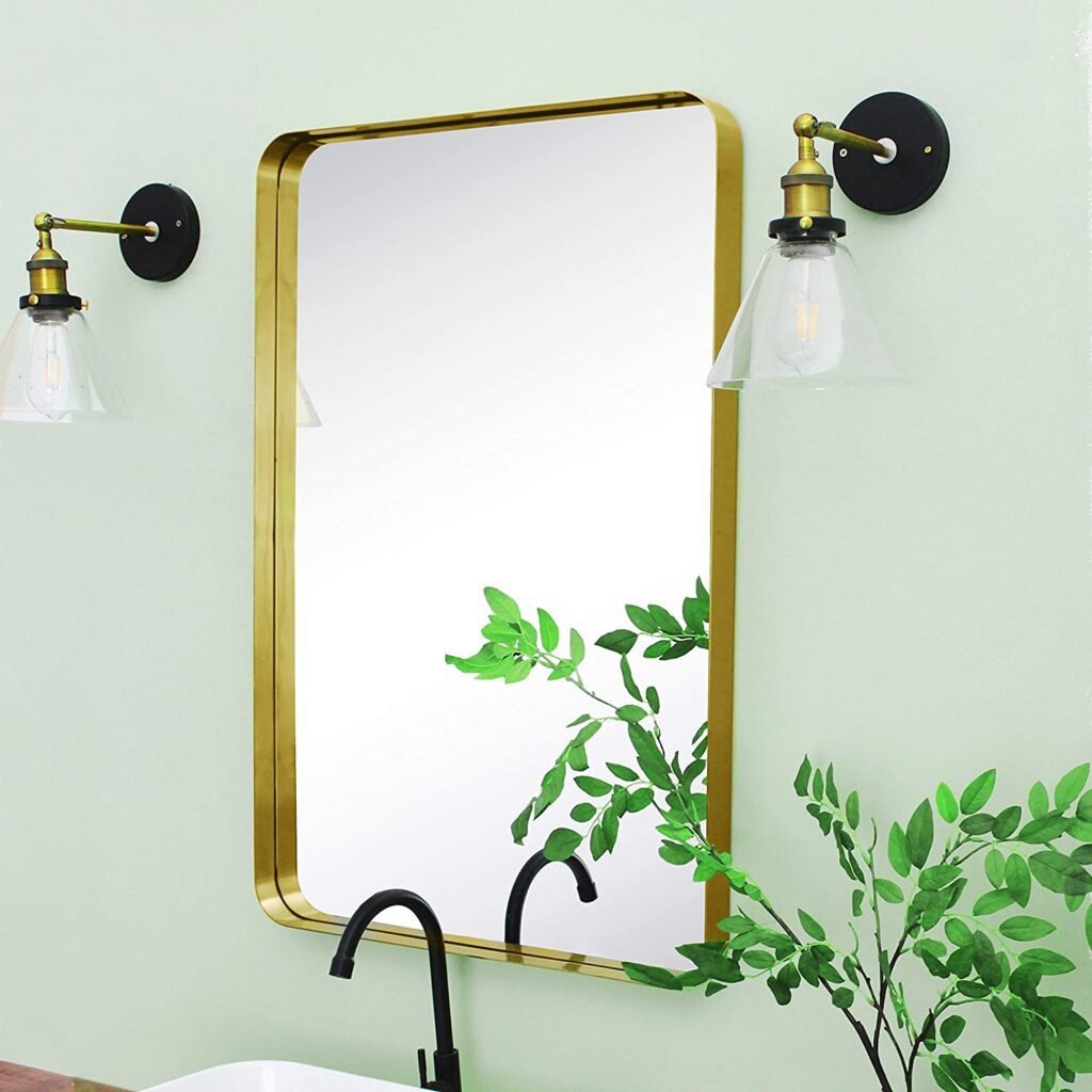 gold mirror with a modern golden ledge