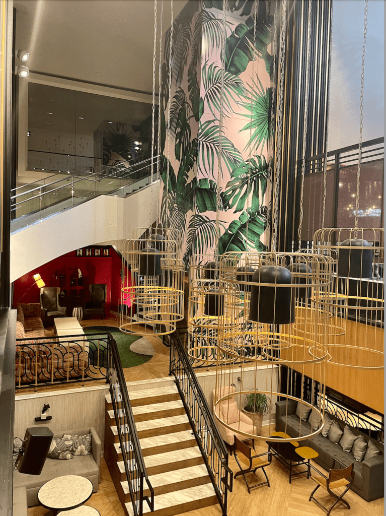 The W Atlanta Midtown - Atlanta's most instagrammable places
Main lobby with palm leaf wallpaper, art deco chandeliers and other eclectic details