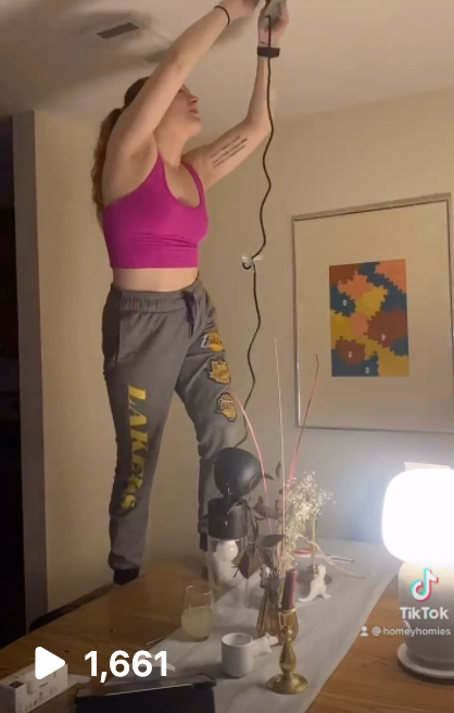 Tiktok thumbnail of me installing a new wired light fixture by myself 