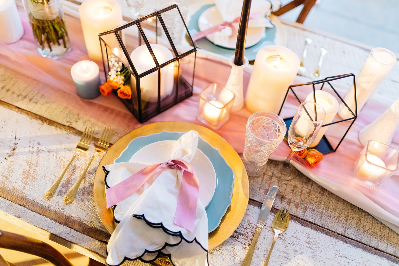 fun and colorful thanksgiving tablescape with pink, blue, and gold accents