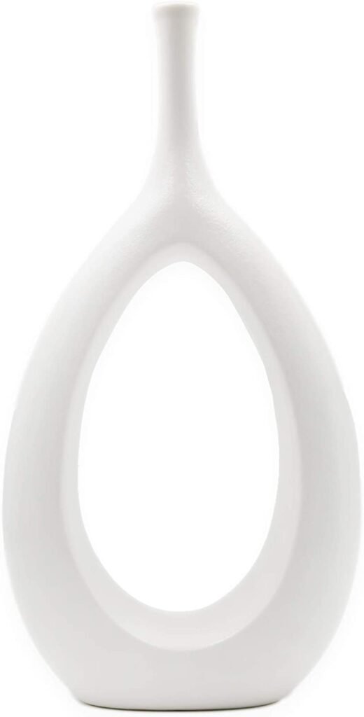 Modern white ceramic vase with a hollow middle 