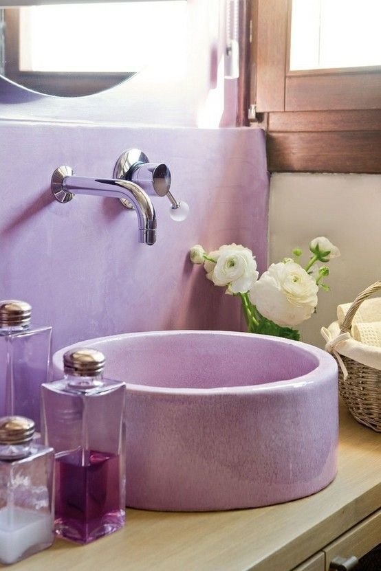 Bathroom vanity with very peri purple sink and wall