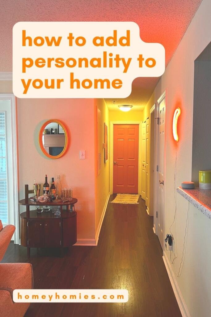 how to add personality to your home - hallway with painted peach door and orange LED moon-shaped light