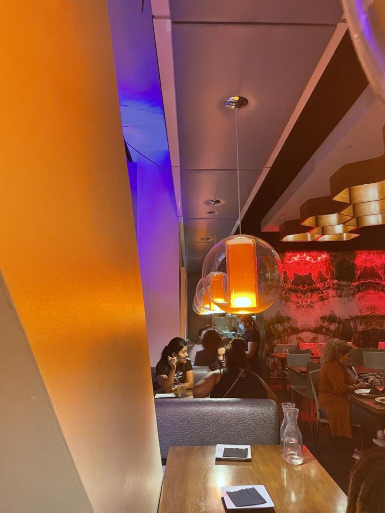THRIVE downtown restaurant with funky globe pendant lights and honeycomb details
