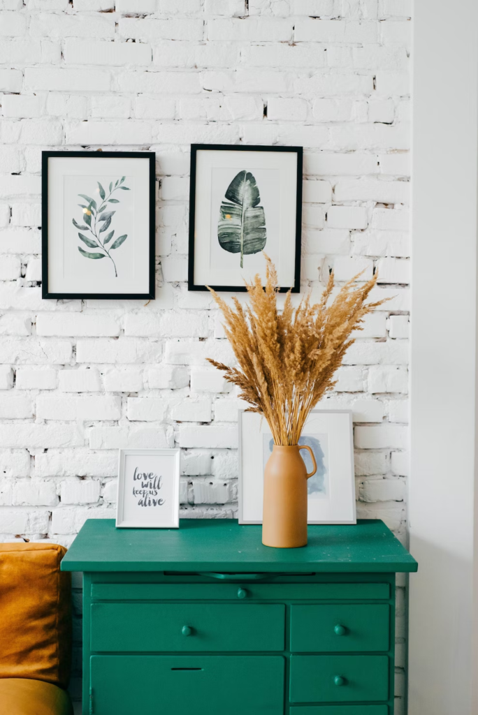 Pampas grass on top of a green side table - fall transition decor