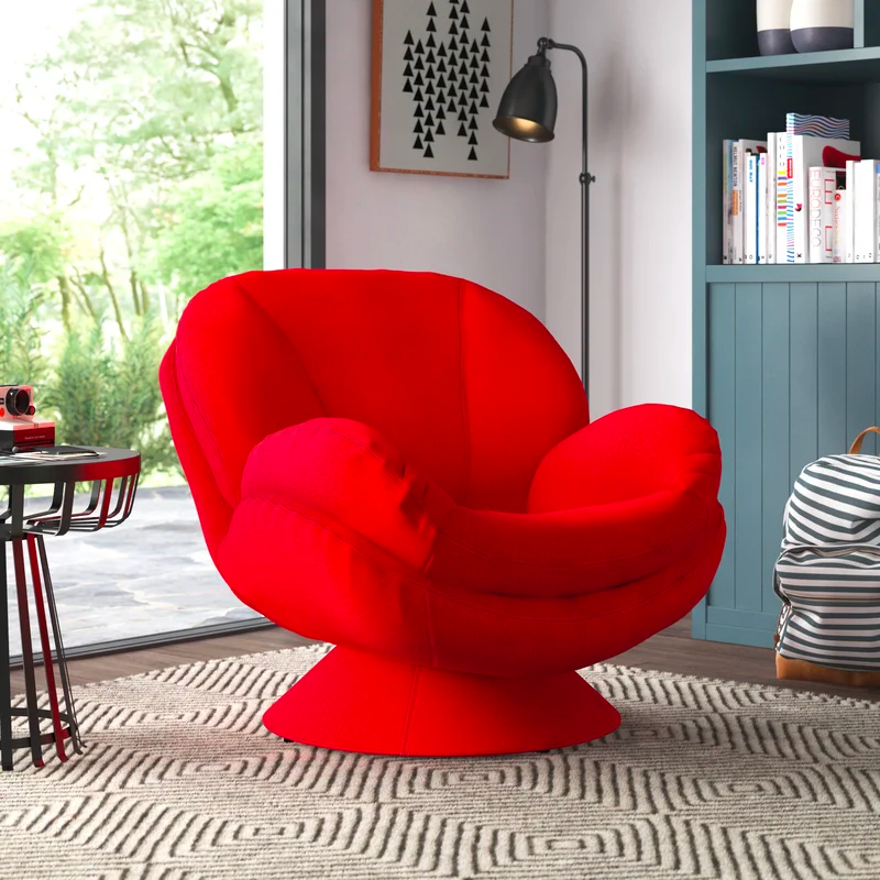 This swivel armchair brings modern comfort and playful style to your living room or entertainment room. It's made with a metal frame that sits on a metal pedestal base that lets you swivel 360°. This chair is wrapped in foam and upholstered in 100% polyester fabric. A unique silhouette showcases a rounded top framed by flared arms with generous all-over cushioning for a plush, inviting feel. And it has a swivel base that makes it ideal for placing by your fireplace. Seam details and a matching cone base complete its modern look.