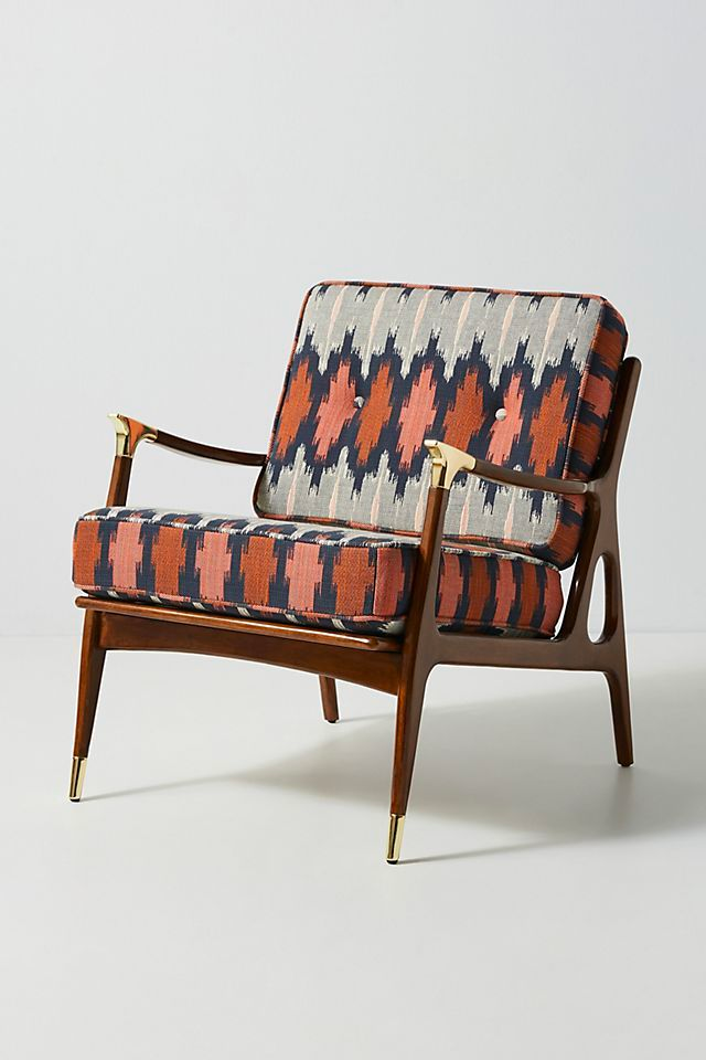 Funky southwestern tribal chair with wood and gold accents from Anthropologie