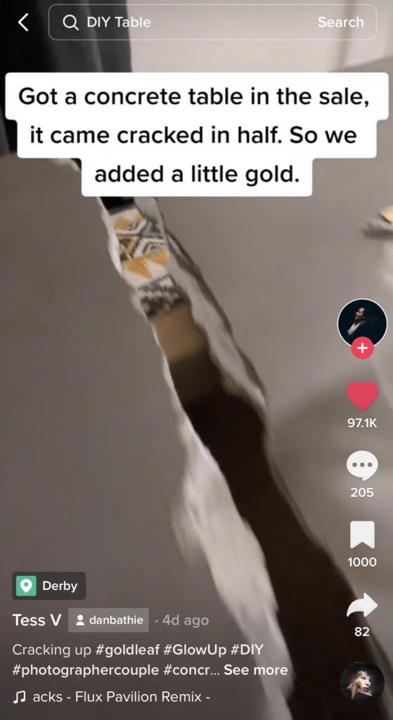 Tiktok showing how to make the best of a cracked coffee table - an example of one of the best 2023 interior design trends