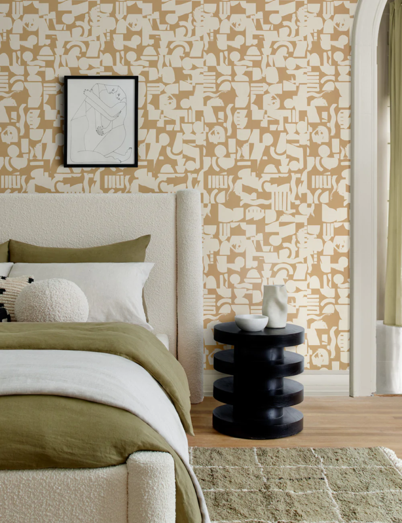 Bedroom with a muted but graphic printed wallpaper